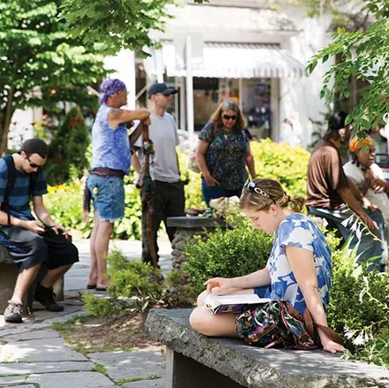 People on the Village Green in Woodtsock - EVA DEITCH