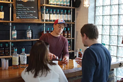 Mark Pisanelli tending bar at Denning's Point Distillery - JOHN GARAY