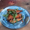 Roasted sweet potatoes with anchovy vinaigrette, currants, and parsley. Roasted sweet potatoes with anchovy vinaigrette, currants, and parsley.