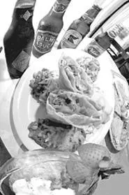 A vegetarian chimichanga with all the fixin's goes great with oh, four beers. - WALTER NOVAK