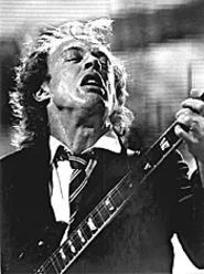 AC/DC's Angus Young makes a guitar face for - photographer Walter Novak. - WALTER NOVAK