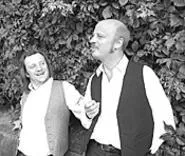 Allen Branstein (left) and Andrew Narten play dimwit hit - men in Charentons Absurdity in the Streets.