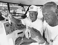 Art Uhas (right) and Bill Brown, hoping to get their lures wet. - WALTER NOVAK