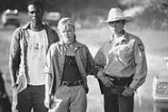 Bat masters: Leon, Dina Meyer, and Lou Diamond Phillips, looking serious in a very silly movie.