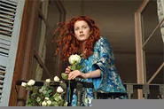 Beyond the girl and roses lies the delicate scent of waffles.