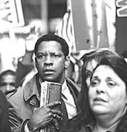 Brainwashed and mind-controlled: Denzel chases - truth -- and an assassin.