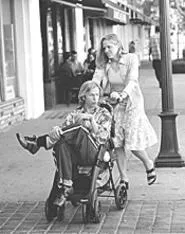 David Spade gets a little push from Mary McCormack in Dickie Roberts.
