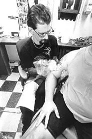 Don Folmer draws a new tattoo for Art Porter, who - learned about tattoo-party regret the hard way. - WALTER NOVAK