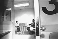 Dr. Kellon advises a nurse in his county jail office. - WALTER NOVAK