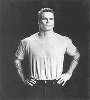 Even his tattoos are tough: Henry Rollins puts on a grumpy face.