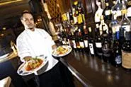 Executive Chef Pete Corfias shows off his lemon-herb grouper and eggplant rollatini. - WALTER NOVAK