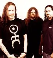 Fear Factory's Christian Olde Wolbers (left) is grateful to play guitar, not fryolator.