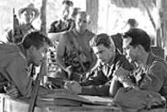 Furrowed brows all around! The Great Raid - cast plots its strategy.