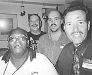 Greg Ammell (second from left), laughing with friends - at his Lakewood home.