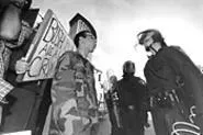In a stand-off between protestors and working stiffs, - the crowd chose the cops. - WALTER NOVAK