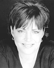 Kathleen Madigan talks about TV, hair, and stupid - people at Hilarities.