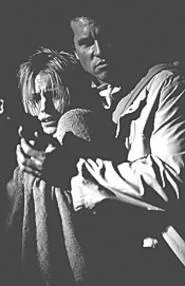 Kristen Bell and Val Kilmer run at the bad guys and - shoot them.