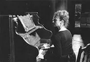 Laura Perrotta, seen here rendering fresh butter at the piano.