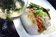 Lemon-basil cream sauce and artichoke risotto help wild Atlantic salmon leap with flavor. - WALTER NOVAK