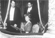 Lily, with suited singles Gus (Aykroyd, left) and Sim - (LaPaglia).