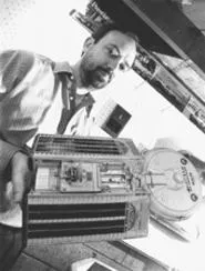 Marc Millis and a spacecraft model he made in the basement. - WALTER NOVAK