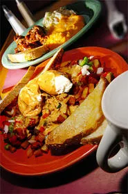 Market Hash's poached eggs rest on a zesty hash-brown bed. - WALTER NOVAK