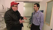 Michael Moore (left) tries to out the cancer in our tumor-ridden health-insurance industry.