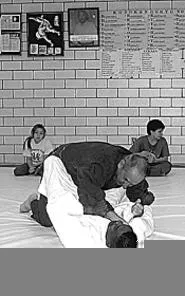 Mid East Judo Clubbers body-slam with style.