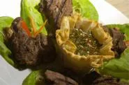 More than a lettuce wrap: With that plateful of pork tenderloin, wise diners will hang onto their forks. - WALTER NOVAK