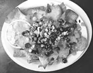 Pita chips stand in for tortillas in Dave's Dirty Nachos.