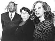 Plaintiff Terrance Jenkins, lawyer Merrie Frost, and - plaintiff Sonja Colwell say that juvenile court discriminates. - WALTER NOVAK