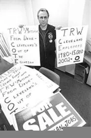 Signs of the times: UAW's John Reichbaum gets his message out. - WALTER NOVAK