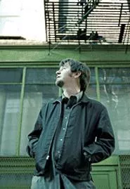 Something catches Jay Farrar's eye as the photographer - patiently waits.