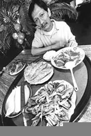 Strokes of Loc: Tay Do owner Loc Nguyen, with a few of his restaurant's - stars. - WALTER NOVAK