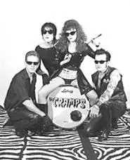 Surprisingly, Cramps frontman Lux Interior (second - from left) was not born sporting lam undies and a - pompadour.