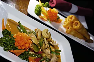 The String Bean: Crunchy cashews top tender-crisp vegetables and sautéed chicken. - WALTER NOVAK