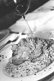 The veal osso buco, atop a mound of red-pepper - risotto, was a long-simmered delight. - WALTER NOVAK