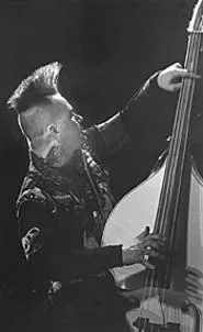 Tiger Army bassist Rob Peltier, doing his thing at the - Agora on November 22. - WALTER NOVAK