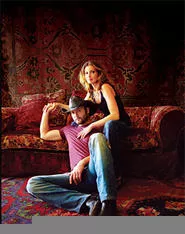 Tim and Faith: Is posing with a whiskey bottle too much to ask?