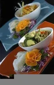 Typhoon of flavor: Mild massaman (front) and spicy green curries. - WALTER NOVAK