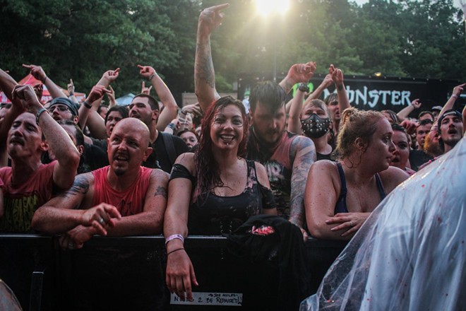 Fans weren't afraid to get wet during Warped Tour 2017 at Blossom. - PHOTO BY ADRIAN LEUTHAUSER