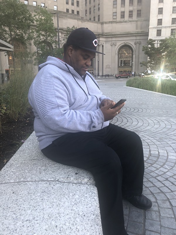 Dimitrius Oliver, 47, uses the WiFi on Public Square - PHOTO BY GABRIELLE GREENE