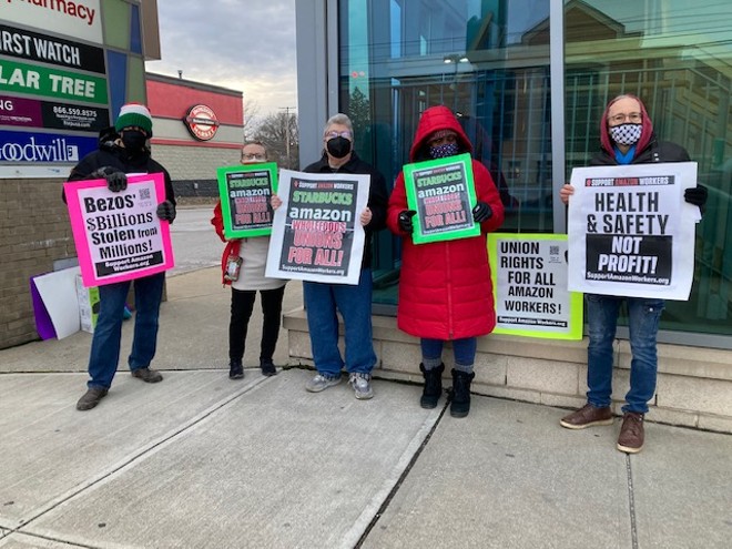 Demonstrators rally outside the Whole Foods in University Heights, (1/12/22). - PHOTO BY SUSAN SCHNUR