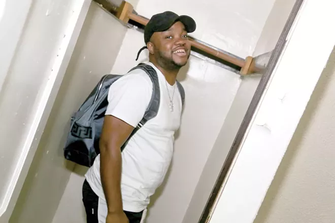 RJ revisits the bedroom closet that served as a recording studio for Royalty Camp's first sessions. - PHOTO BY EMANUEL WALLACE