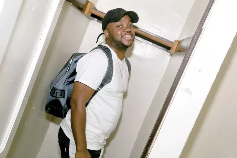 RJ revisits the bedroom closet that served as a recording studio for Royalty Camp's first sessions. - PHOTO BY EMANUEL WALLACE