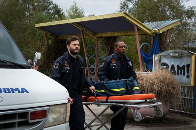 Paramedics Dennis, left, and Steve take care of New Orleans' wounded, and each other, but they aren't prepared for where "Synchronic" will take them. - WELL GO USA ENTERTAINMENT