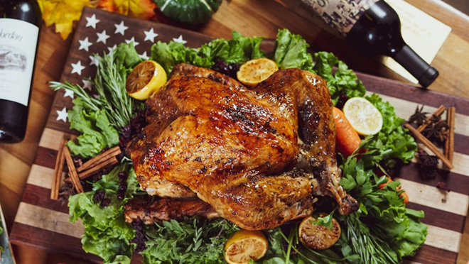 American Social's full meal to-go includes a honey glazed ham, over roasted sliced turkey, or garlic and herb roasted prime rib plus a bevy of sides and wine. - AMERICAN SOCIAL