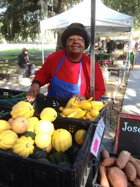 Helen Fields of Joseph Fields Farm has a welcome smile for everyone who visits her display of organic produce at Forsyth Farmers' Market.