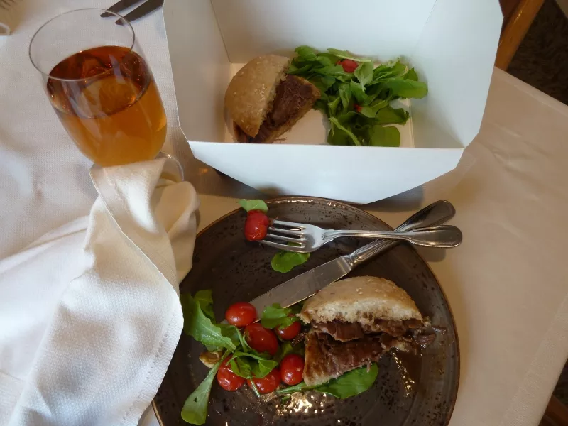 One way to stay on track with your healthy eating goals when you eat out is to ask the server to put half your entrée in a to-go container. That way you can prevent eating too large a portion and also stretch your dining-out dollars across two meals.