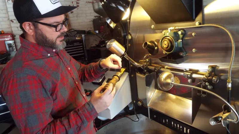 Philip Brown keeps a watchful eye on the coffee roasting process at PERC’s new-ish digs on East Broad.